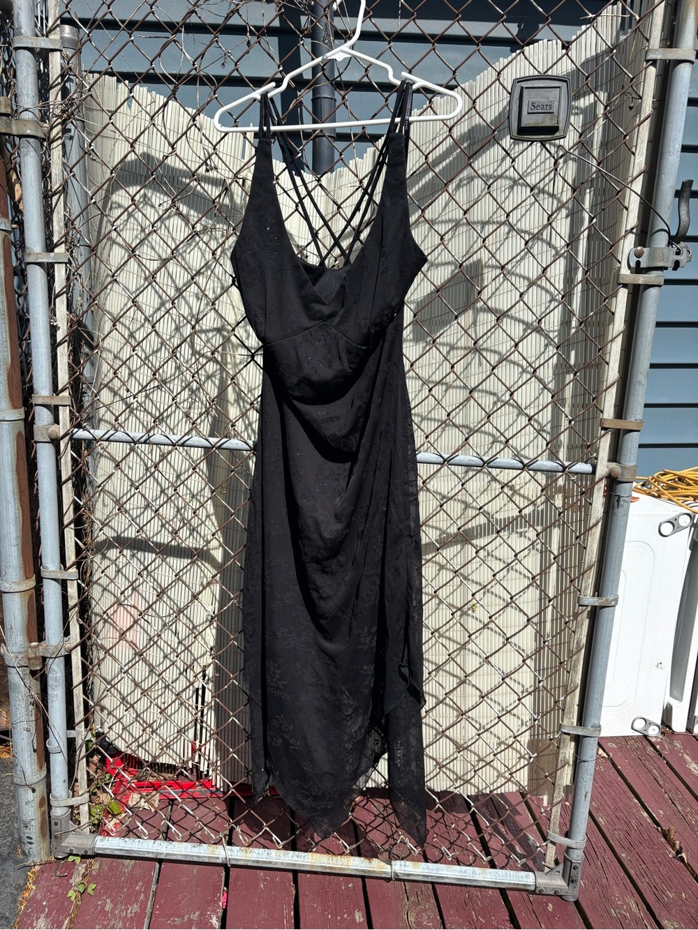 CDC black midi dress with floral pattern; strapped back